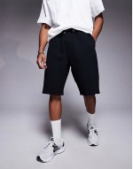 longer length denim jort in light wash blue with tint