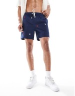 Traveler icon logo slim fit mid swim shorts in beige